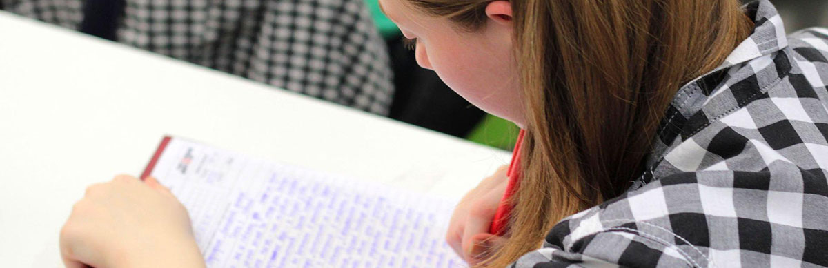 A student writes during intervention time in school.