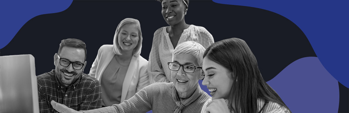 A group of educators discusses options for their Middle School schedule and looks at schedule examples on a computer.